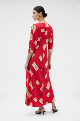 Profile view of model wearing the Oroton Vintage Label Print Dress in Market Red and 100% silk twill fabric for Women . IP:5