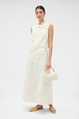 Profile view of model wearing the Oroton Bow Detail Shell in Soft Cream and 100% heavyweight linen fabric for Women . IP:6