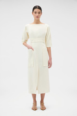 Profile view of model wearing the Oroton Button Detail Dress in Soft Cream and 100% heavyweight linen fabric for Women . IP:2