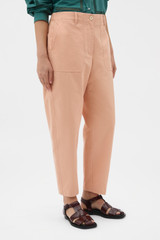 Profile view of model wearing the Oroton Curved Leg Pant in Apple Peach and 100% cotton fabric for Women . IP:3