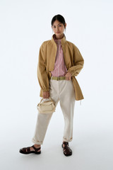 Profile view of model wearing the Oroton Arlo Carpenter Chino in Calico and 100% cotton fabric for Women . IP:8