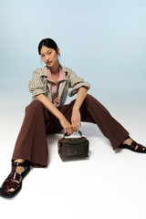 Profile view of model wearing the Oroton Wren Stripe Shirt in Chocolate and 100% cotton poplin fabric for Women . IP:8