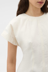 Profile view of model wearing the Oroton Stitch Detail Fitted Top in Calico and 100% cotton fabric for Women . IP:4