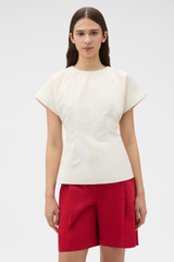 Profile view of model wearing the Oroton Stitch Detail Fitted Top in Calico and 100% cotton fabric for Women . IP:2