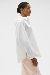 Profile view of model wearing the Oroton Button Detail Poplin Shirt in White and 100% cotton poplin fabric for Women . IP:3