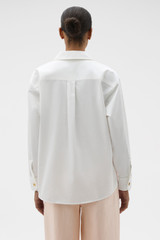 Profile view of model wearing the Oroton Button Detail Poplin Shirt in White and 100% cotton poplin fabric for Women . IP:5