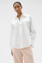 Profile view of model wearing the Oroton Button Detail Poplin Shirt in White and 100% cotton poplin fabric for Women . IP:2