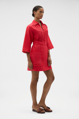 Profile view of model wearing the Oroton Handkerchief Tunic Dress in Ribbon Red and 100% mid-weight linen fabric for Women . IP:3