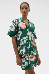Profile view of model wearing the Oroton Cabana Floral Camp Shirt in Helm Green and 100% silk dupion fabric for Women . IP:2