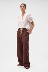 Profile view of model wearing the Oroton Weekend Pull On Pant in Milk Chocolate and 100% cotton fabric for Women . IP:3
