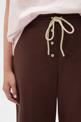 Profile view of model wearing the Oroton Weekend Pull On Pant in Milk Chocolate and 100% cotton fabric for Women . IP:4