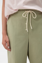 Profile view of model wearing the Oroton Weekend Pull On Pant in Soft Sage and 100% cotton fabric for Women . IP:4