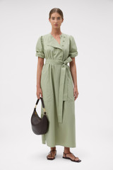 Profile view of model wearing the Oroton Isla Detail Dress in Soft Sage and 100% cotton poplin fabric for Women . IP:6