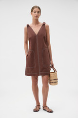 Profile view of model wearing the Oroton Tie Shoulder A-Line Dress in Milk Chocolate and 100% cotton fabric for Women . IP:6