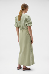 Profile view of model wearing the Oroton Snap Detail Skirt in Soft Sage and 100% cotton fabric for Women . IP:5