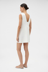 Profile view of model wearing the Oroton Tassel Lace Shift Dress in White and 45% viscose, 30% rayon, and 25% linen blend fabric for Women . IP:5