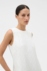 Profile view of model wearing the Oroton Tassel Lace Shift Dress in White and 45% viscose, 30% rayon, and 25% linen blend fabric for Women . IP:4