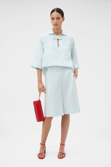 Profile view of model wearing the Oroton Tab Detail Culotte in Ice Blue and 100% heavy weight linen fabric for Women . IP:6