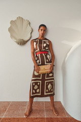 Profile view of model wearing the Oroton Graphic Shell Slip Skirt in Dark Chocolate and 100% silk twill fabric for Women . IP:8