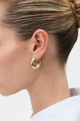 Profile view of model wearing the Oroton Aurie Hoops in Gold and Brass with sterling silver earring post for Women . IP:2