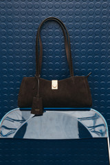 Profile view of model wearing the Oroton Mille Suede Baguette in Dark Chocolate and Premium suede leather for Women . IP:9