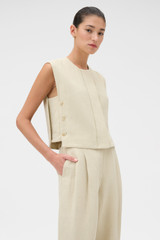 Profile view of model wearing the Oroton Button Detail Vest in Almond Creme and 72% Viscose, 28% linen for Women . IP:3