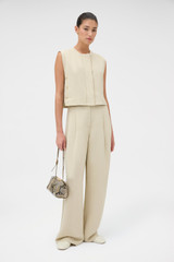 Profile view of model wearing the Oroton Button Detail Vest in Almond Creme and 72% Viscose, 28% linen for Women . IP:6