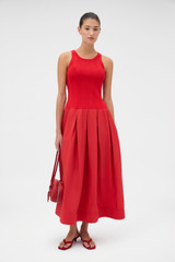 Profile view of model wearing the Oroton Knit Bodice Midi Dress in Ribbon Red and Knit: 100% cotton; Skirt: 77% viscose, 23% polyester for Women . IP:6