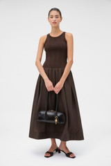 Profile view of model wearing the Oroton Knit Bodice Midi Dress in Dark Chocolate and Knit: 100% cotton; Skirt: 77% viscose, 23% polyester for Women . IP:6