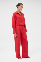 Profile view of model wearing the Oroton Belt Detail Pant in Ribbon Red and 77% viscose and 23% polyamide blend fabric for Women . IP:3