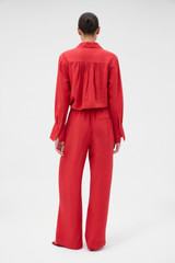 Profile view of model wearing the Oroton Belt Detail Pant in Ribbon Red and 77% viscose and 23% polyamide blend fabric for Women . IP:5