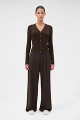 Profile view of model wearing the Oroton Belt Detail Pant in Dark Chocolate and 95% wool and 5% Lycra blend fabric for Women . IP:2