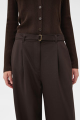 Profile view of model wearing the Oroton Belt Detail Pant in Dark Chocolate and 95% wool and 5% Lycra blend fabric for Women . IP:4
