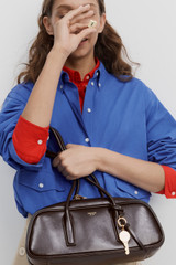 Profile view of model wearing the Oroton Louisa Crackle Shoulder Bag in Dark Chocolate and Premium smooth leather for Women . IP:8