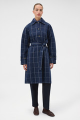 Profile view of model wearing the Oroton Sunday Check Mac in North Sea and 100% cotton fabric for Women . IP:2