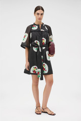 Profile view of model wearing the Oroton Folk Doilie Print Smock Dress in Black and 100% cotton fabric for Women . IP:2