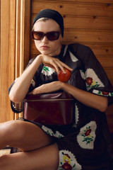 Profile view of model wearing the Oroton Folk Doilie Print Smock Dress in Black and 100% cotton fabric for Women . IP:6