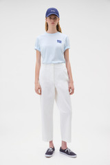 Profile view of model wearing the Oroton Arlo Carpenter Chino in Antique White and 100% cotton fabric for Women . IP:2