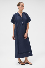 Profile view of model wearing the Oroton Trim Detail Dress in North Sea and 100% cotton fabric for Women . IP:3