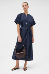 Profile view of model wearing the Oroton Trim Detail Dress in North Sea and 100% cotton fabric for Women . IP:6
