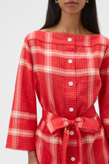 Profile view of model wearing the Oroton Vintage Check Tunic Dress in Ribbon Red and 100% midweight linen fabric for Women . IP:4