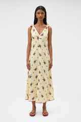 Profile view of model wearing the Oroton Wallpaper Floral Print Dress in Lemon and 100% midweight linen fabric for Women . IP:2