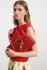 Profile view of model wearing the Oroton Ruffle Detail Top in Red Ribbon and 100% cotton voile fabric for Women . IP:9