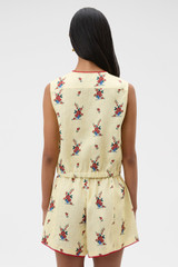 Profile view of model wearing the Oroton Wallpaper Floral Print Top in Lemon and 100% midweight linen fabric for Women . IP:5