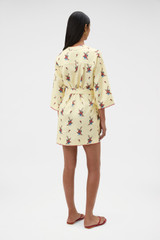 Profile view of model wearing the Oroton Wallpaper Floral Print Tunic Dress in Lemon and 100% midweight linen fabric for Women . IP:5