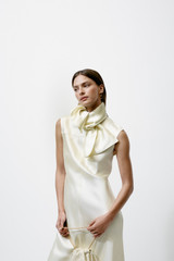 Profile view of model wearing the Oroton Double Satin Sheath Dress in Champagne and 100% viscose fabric for Women . IP:10