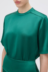Profile view of model wearing the Oroton Double Satin Tee in Neptune Green and 100% viscose fabric for Women . IP:5