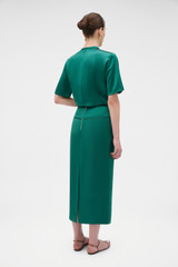 Profile view of model wearing the Oroton Double Satin Midi Skirt in Neptune Green and 100% viscose fabric for Women . IP:5
