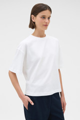 Profile view of model wearing the Oroton Relaxed Sleeve Tee in Antique White and 100% cotton fabric for Women . IP:5