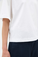 Profile view of model wearing the Oroton Relaxed Sleeve Tee in Antique White and 100% cotton fabric for Women . IP:4
